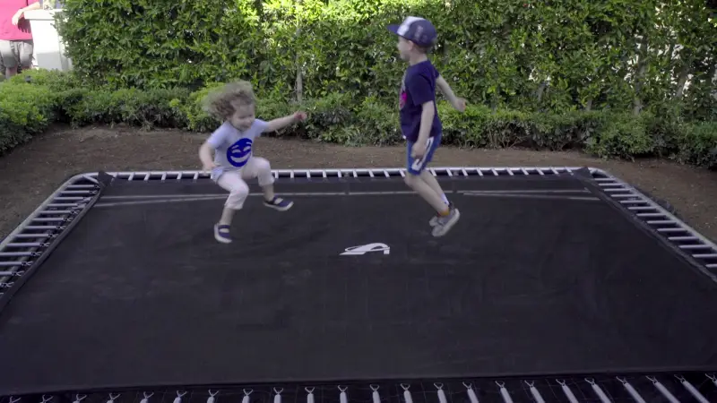 children jumping on a rectangular